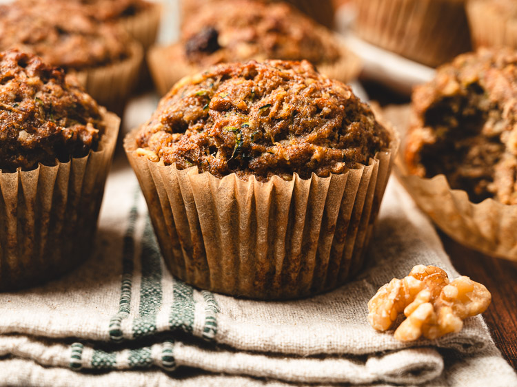 zucchini oatmeal muffins arranged on a dish towel