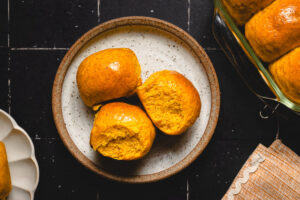 pumpkin dinner rolls on plates