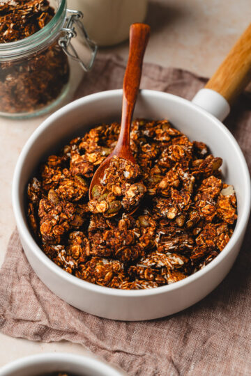 date sweetened granola in a bowl with spoon