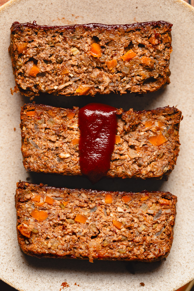 close up slices of vegan meatloaf on a plate