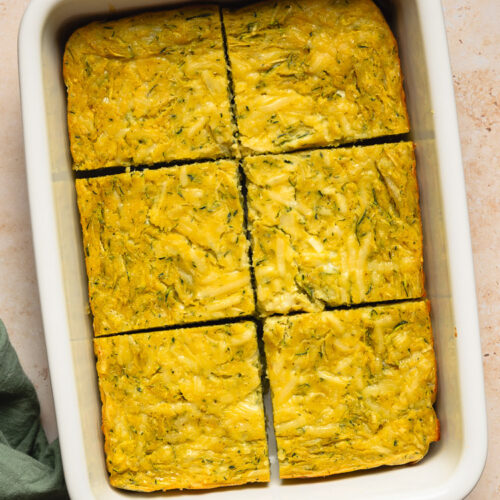 a pan of vegan zucchini slice cut into slices