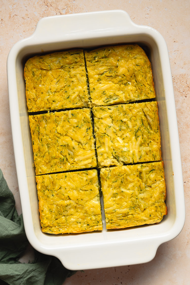 a pan of vegan zucchini slice cut into slices